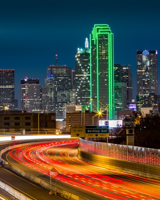 lit up dallas cityscape at night 