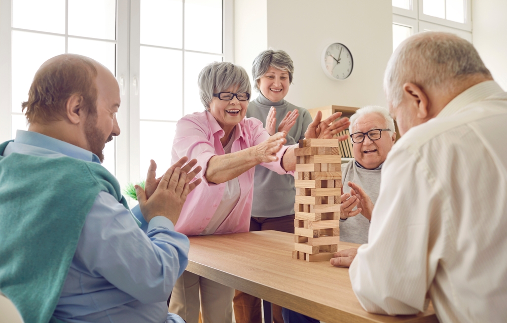 Senior citizens having fun in bright lit room